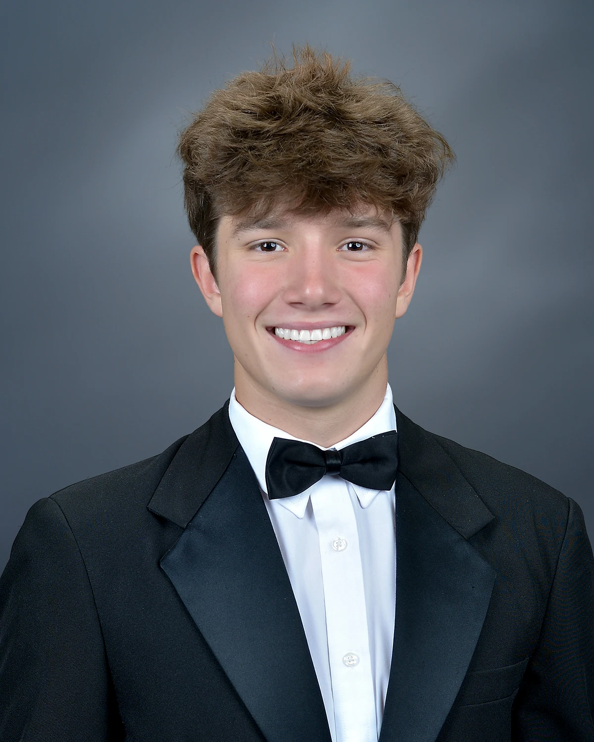 Senior portrait of man in a tuxedo