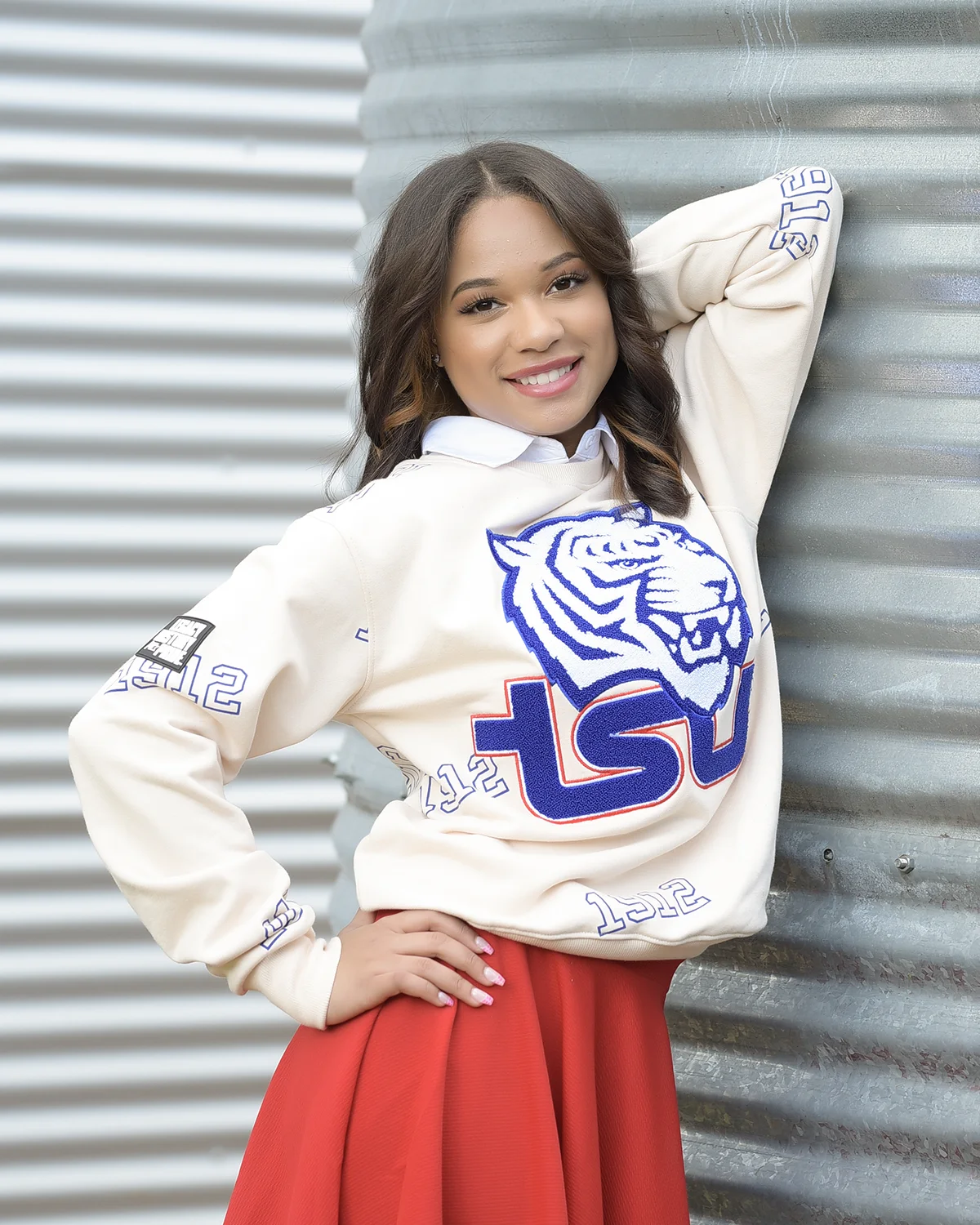Senior portrait of woman in school sweater